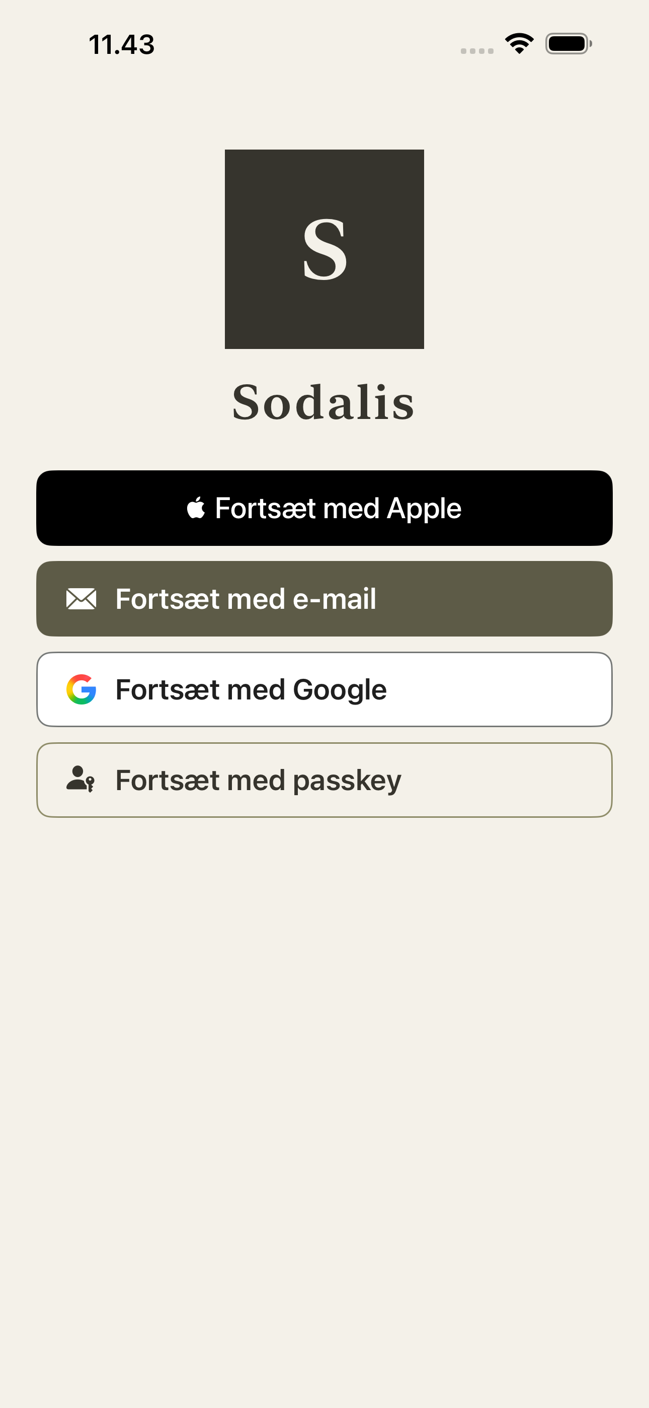 The Sodalis sign-in screen before any club is known: a dark square mark holding the letter S, the product name Sodalis set in a serif below it, and four ways in stacked as full-width buttons in Danish — continue with Apple, with e-mail, with Google, with a passkey. No password field anywhere.